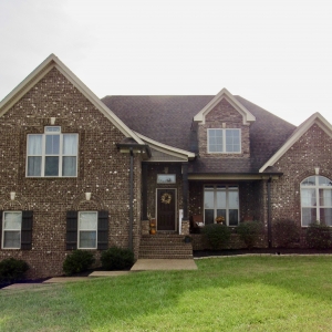 50 Harbor Point | Exteriors features Brick, Natural Stone, & Rich Wood Accents