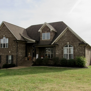 50 Harbor Point | Exteriors features Brick, Natural Stone, & Rich Wood Accents
