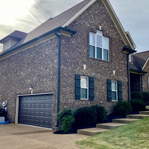 50 Harbor Point | Exteriors features Brick, Natural Stone, & Rich Wood Accents