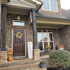 50 Harbor Point | Exteriors features Brick, Natural Stone, & Rich Wood Accents