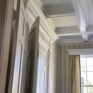 Wainscoting Coffered Ceiling and French Doors | The Dining Room is elegant with every detail