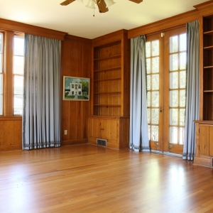 Den | Natural stained wood walls in the brightly lit den Den | Natural stained wood walls in the brightly lit den